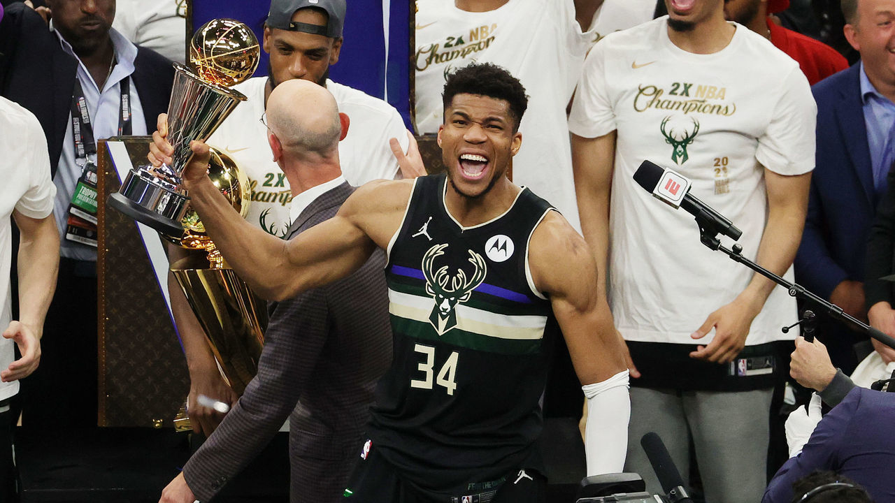 MILWAUKEE, WISCONSIN - JULY 20: Giannis Antetokounmpo #34 of the Milwaukee Bucks celebrates winning the Bill Russell NBA Finals MVP Award after defeating the Phoenix Suns in Game Six to win the 2021 NBA Finals at Fiserv Forum on July 20, 2021 in Milwaukee, Wisconsin.