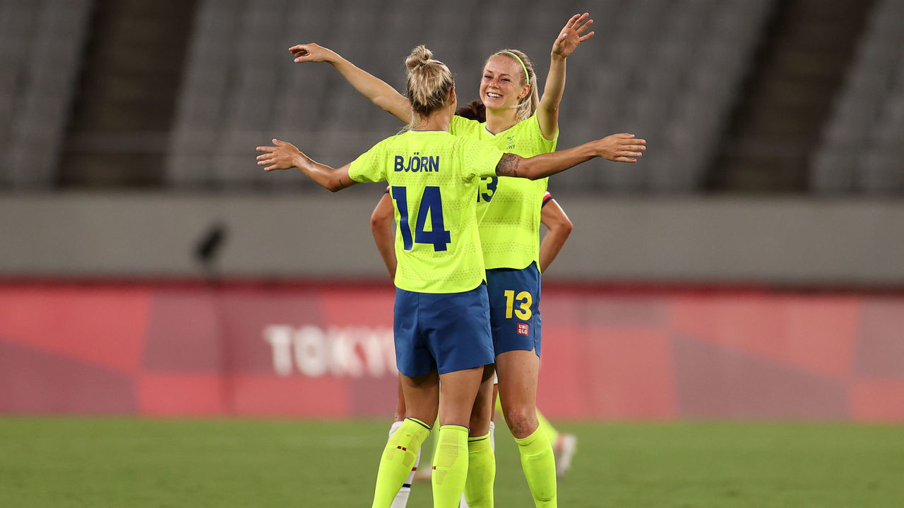CHOFU, JAPAN - JULY 21: Amanda Ilestedt #13 of Team Sweden celebrates their side's victory with team mate Nathalie Bjorn #14 after the Women's First Round Group G match between Sweden and United States during the Tokyo 2020 Olympic Games at Tokyo Stadium on July 21, 2021 in Chofu, Tokyo, Japan.