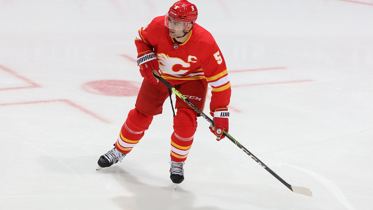 CALGARY, AB - APRIL 19: Mark Giordano #5 of the Calgary Flames skates up ice against the Ottawa Senators at Scotiabank Saddledome on April 19, 2021 in Calgary, Alberta, Canada.