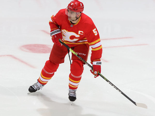 CALGARY, AB - APRIL 19: Mark Giordano #5 of the Calgary Flames skates up ice against the Ottawa Senators at Scotiabank Saddledome on April 19, 2021 in Calgary, Alberta, Canada.