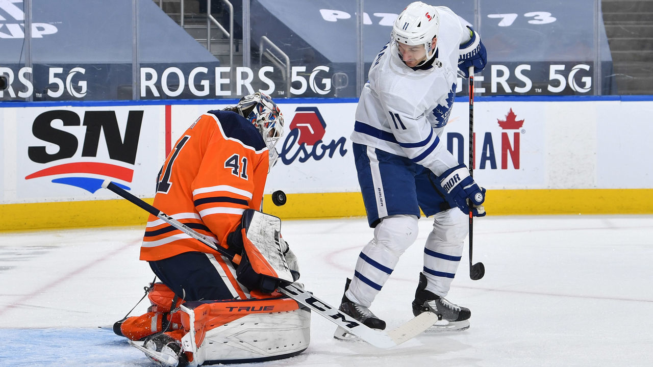 EDMONTON, AB - MARCH 3: Mike Smith #41 of the Edmonton Oilers makes a save on Zach Hyman #11 of the Toronto Maple Leafs on March 3, 2021 at Rogers Place in Edmonton, Alberta, Canada.