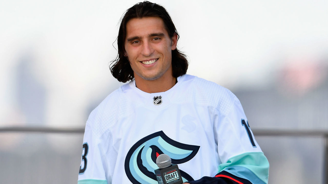 SEATTLE, WASHINGTON - JULY 21: Chris Tanev is interviewed after being drafted by the Seattle Kraken during the 2021 NHL Expansion Draft at Gas Works Park on July 21, 2021 in Seattle, Washington. The Kracken is the National Hockey League's newest franchise and will begin play in October 2021.