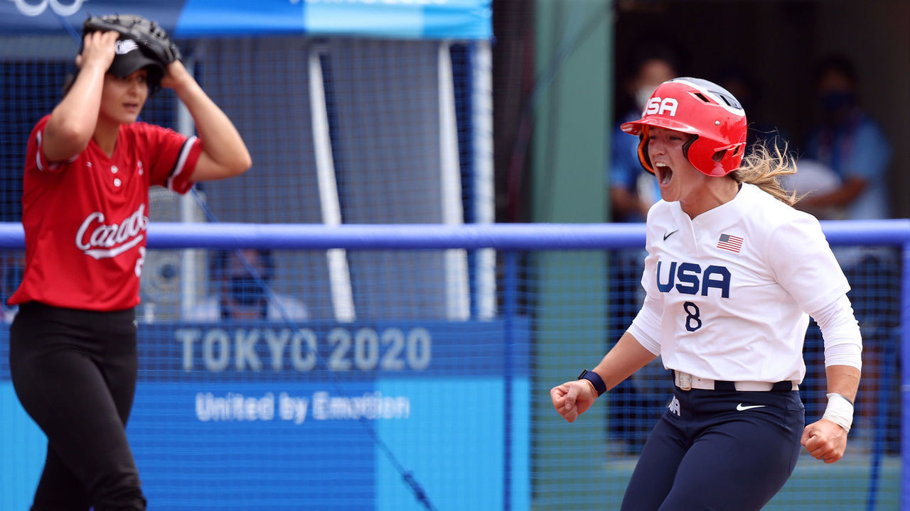 FUKUSHIMA, JAPAN - JULY 22: Pitcher Eujenna Caira #29 of Team Canada and Haylie McCleney #8 of Team United States react after McCleney scored in the fifth inning during the Softball Opening Round of the Tokyo 2020 Olympic Games at Fukushima Azuma Baseball Stadium on July 22, 2021 in Fukushima, Japan.