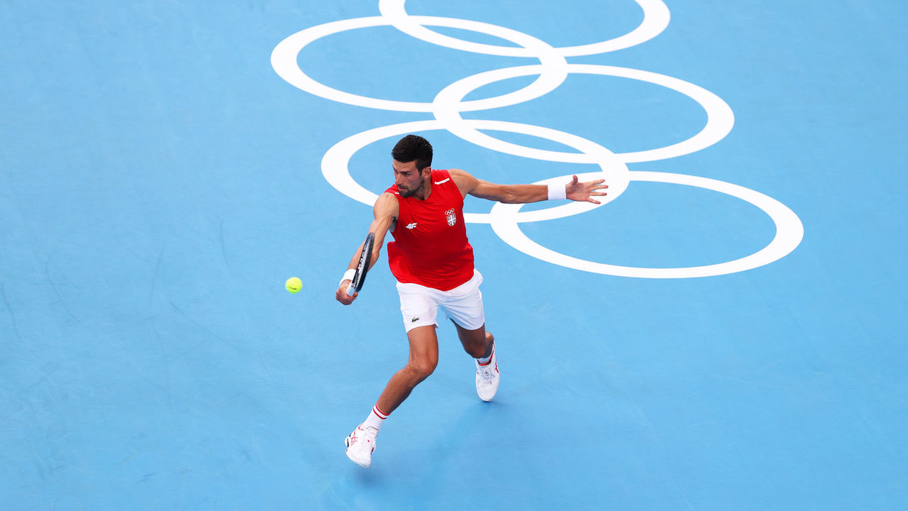 TOKYO, JAPAN - JULY 22: Novak Djokovic of Team Serbia plays a backhand shot during a practice match against Andy Murray of Team Great Britain ahead of the Tokyo 2020 Olympic Games at Ariake Tennis Park on July 22, 2021 in Tokyo, Japan.
