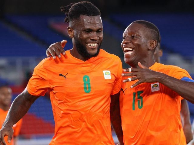 Ivory Coast's midfielder Franck Kessie (L) celebrates with Ivory Coast's forward Max Gradel after he scored his side's second goal during the Tokyo 2020 Olympic Games men's group D first round football match between Ivory Coast and Saudi Arabia at the Yokohama International Stadium in Yokohama on July 22, 2021.