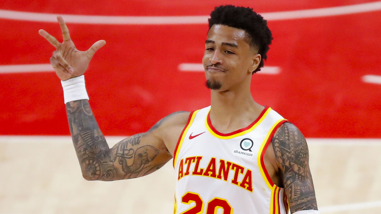 ATLANTA, GA - MAY 13: John Collins #20 of the Atlanta Hawks reacts after a three pointer during the second half against the Orlando Magic at State Farm Arena on May 13, 2021 in Atlanta, Georgia. NOTE TO USER: User expressly acknowledges and agrees that, by downloading and/or using this photograph, user is consenting to the terms and conditions of the Getty Images License Agreement.
