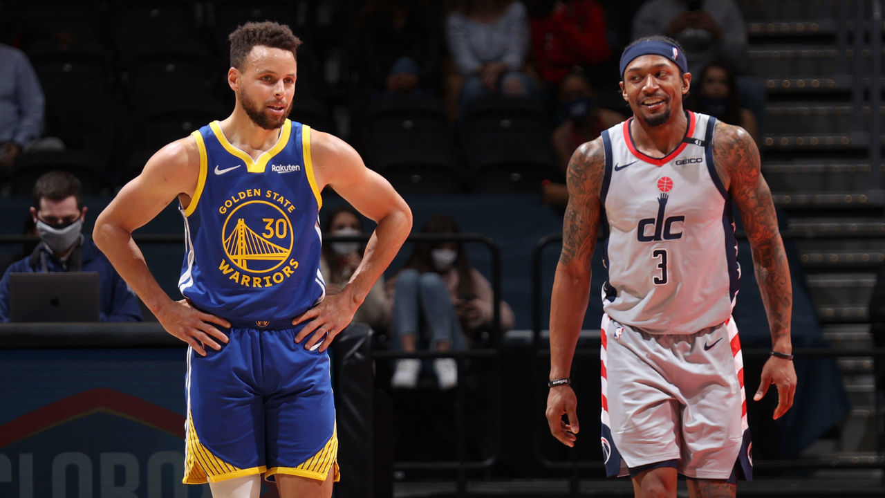 WASHINGTON, DC - APRIL 21: Stephen Curry #30 of the Golden State Warriors and Bradley Beal #3 of the Washington Wizards look on during the game on April 21, 2021 at Capital One Arena in Washington, DC. Mandatory Copyright Notice: Copyright 2021 NBAE