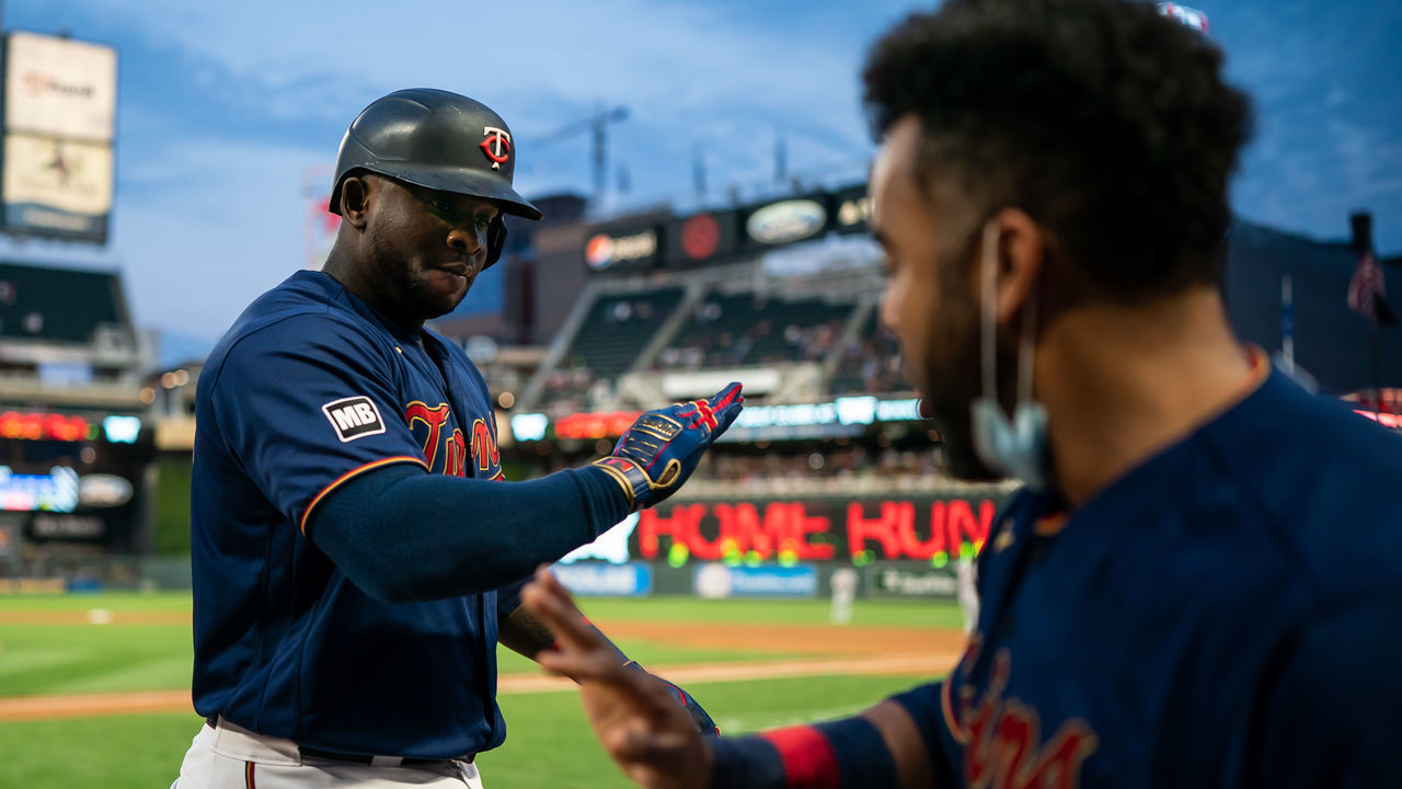 MINNEAPOLIS, MN - JULY 08: Miguel Sano #22 of the Minnesota Twins celebrates with Nelson Cruz #23 against the Detroit Tigers on July 8, 2021 at Target Field in Minneapolis, Minnesota.