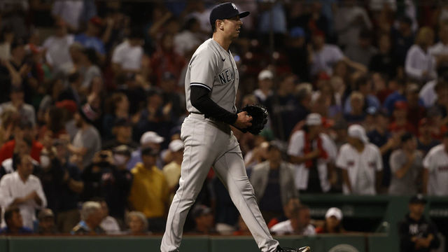 BOSTON, MA - JULY 22: Pitcher Brooks Kriske #82 of the New York Yankees walks back to the mound after throwing a wild pitch in the 10th inning against the Boston Red Sox at Fenway Park on July 22, 2021 in Boston, Massachusetts.
