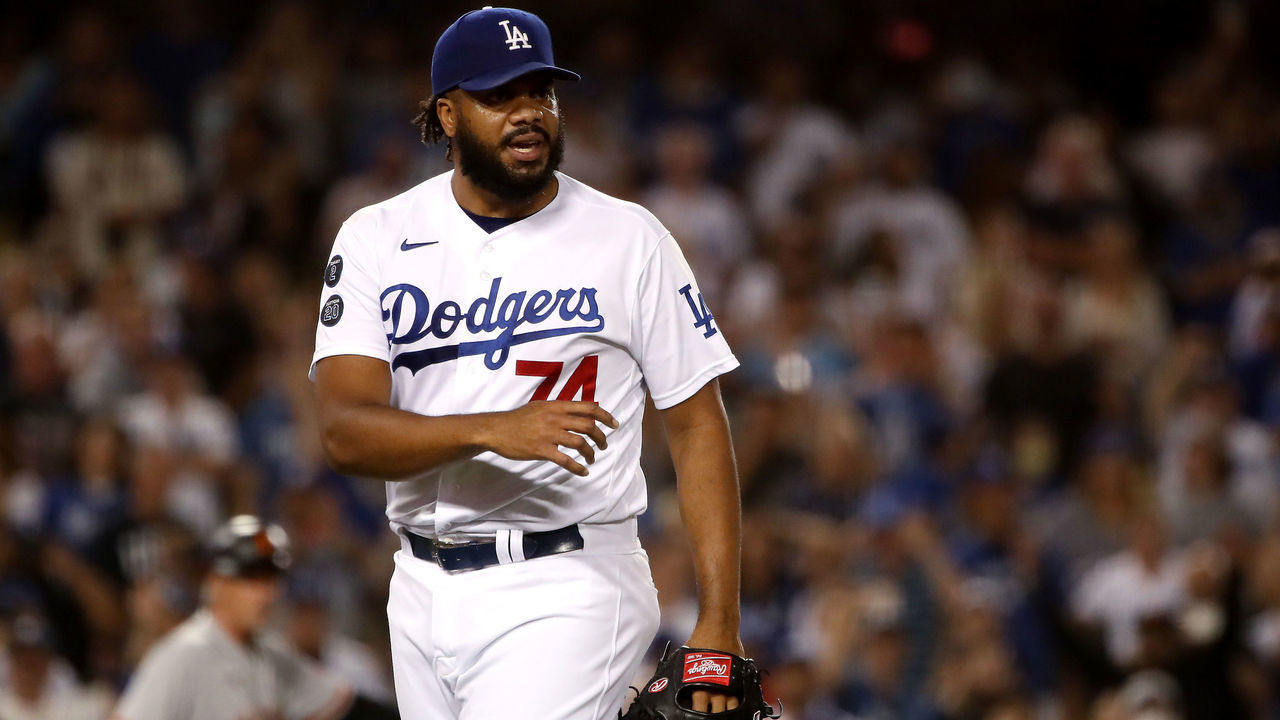 LOS ANGELES, CALIFORNIA - JULY 22: Kenley Jansen #74 of the Los Angeles Dodgers reacts after first base umpire Ed Hickox #15 made the call to walk Darin Ruf #33 of the San Francisco Giants to tie the game 3-3 during the ninth inning at Dodger Stadium on July 22, 2021 in Los Angeles, California.