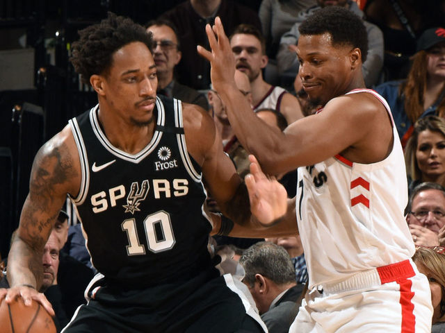 TORONTO, CANADA - JANUARY 12: DeMar DeRozan #10 of the San Antonio Spurs handles the ball against Kyle Lowry #7 of the Toronto Raptors on January 12, 2020 at the Scotiabank Arena in Toronto, Ontario, Canada. Mandatory Copyright Notice: Copyright 2020 NBAE
