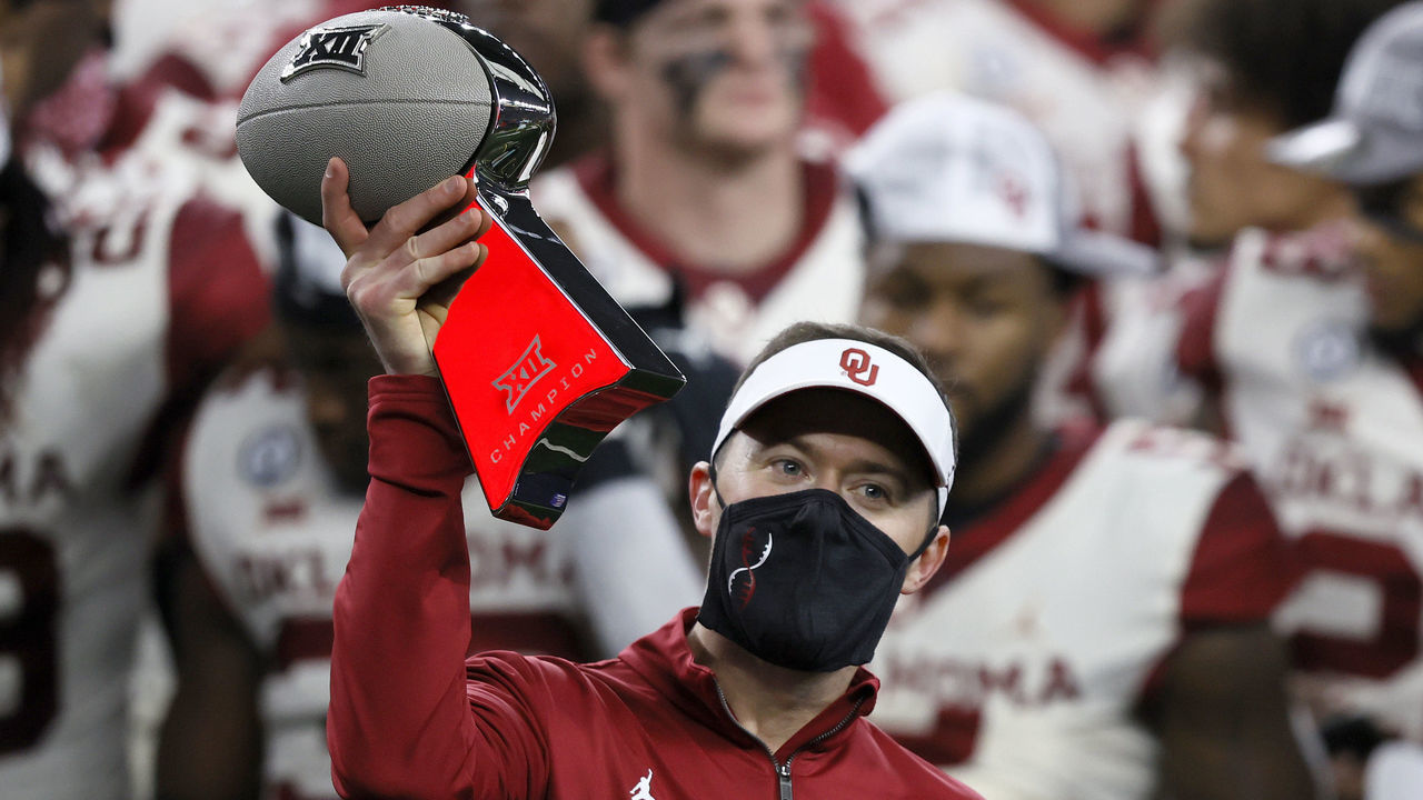 ARLINGTON, TEXAS - DECEMBER 19: Head coach Lincoln Riley of the Oklahoma Sooners hoists the Big 12 Championship trophy after the Sooners beat the Iowa State Cyclones 27-21 in the 2020 Dr Pepper Big 12 Championship football game at AT&T Stadium on December 19, 2020 in Arlington, Texas.