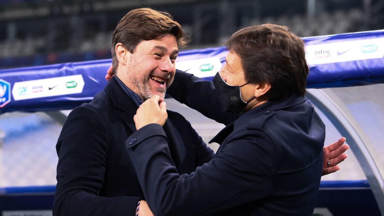 Paris Saint-Germain's Argentinian head coach Mauricio Pochettino (L) celebrates with Paris Saint-Germain's Brazilian sporting director Leonardo after winning the French Cup final football match between Paris Saint-Germain and Monaco at the Stade de France stadium, in Saint-Denis, on the outskirts of Paris, on May 19, 2021.