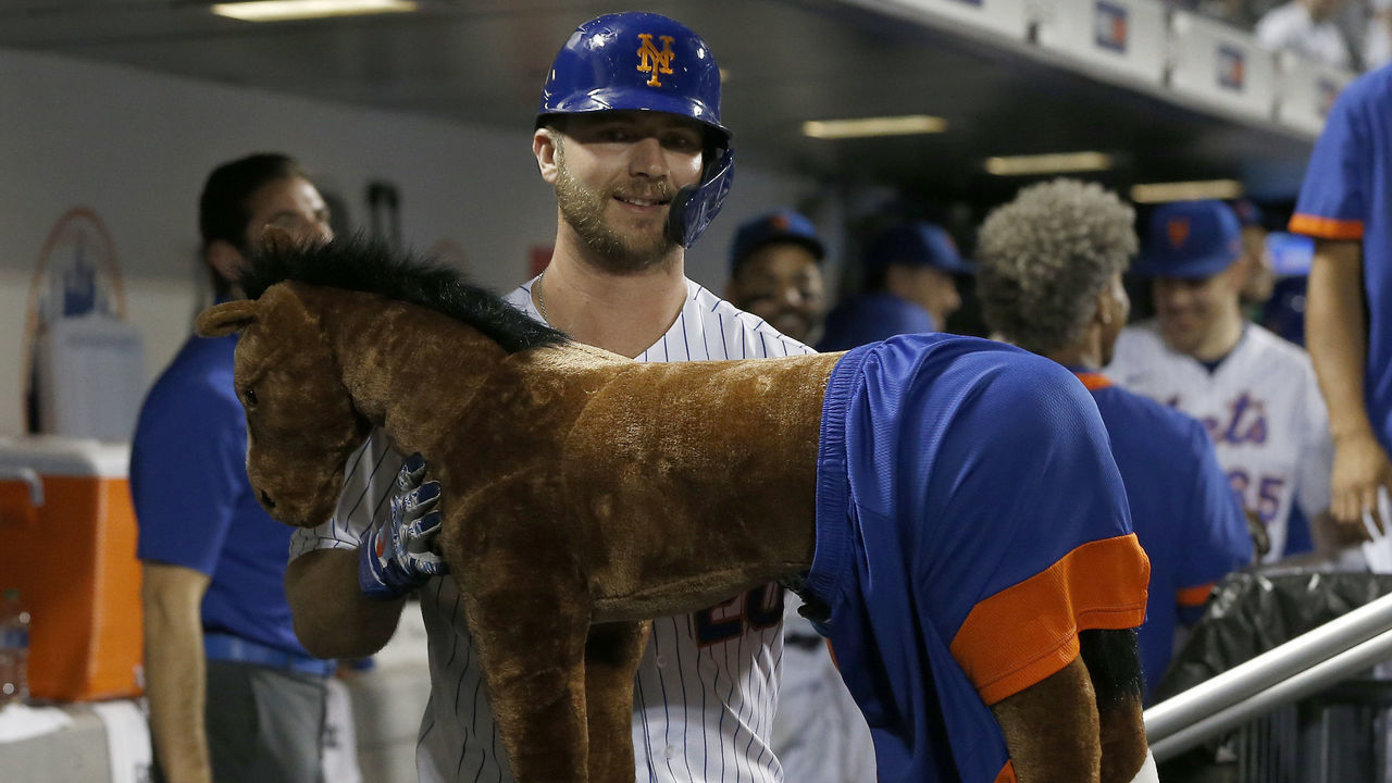 NEW YORK, NEW YORK - JULY 23: Pete Alonso #20 of the New York Mets celebrates his home run in the eighth inning against the Toronto Blue Jays with the 'Home Run Horse' in the dugout at Citi Field on July 23, 2021 in New York City.