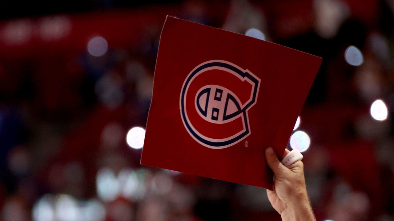 MONTREAL, QUEBEC - JULY 05: A fan of the Montreal Canadiens holds up a cardboard placard with a Canadiens logo after the overtime game-winning goal by Josh Anderson #17 of the Montreal Canadiens (not in photo) in the first over time of Game Four of the 2021 Stanley Cup Final against the Tampa Bay Lightning at Bell Centre on July 05, 2021 in Montreal, Quebec.