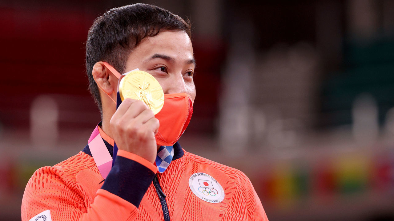 TOKYO, JAPAN - JULY 24: Naohisa Takato of Team Japan, poses with the gold medal for the Men’s Judo 60kg Final on day one of the Tokyo 2020 Olympic Games at Nippon Budokan on July 24, 2021 in Tokyo, Japan.
