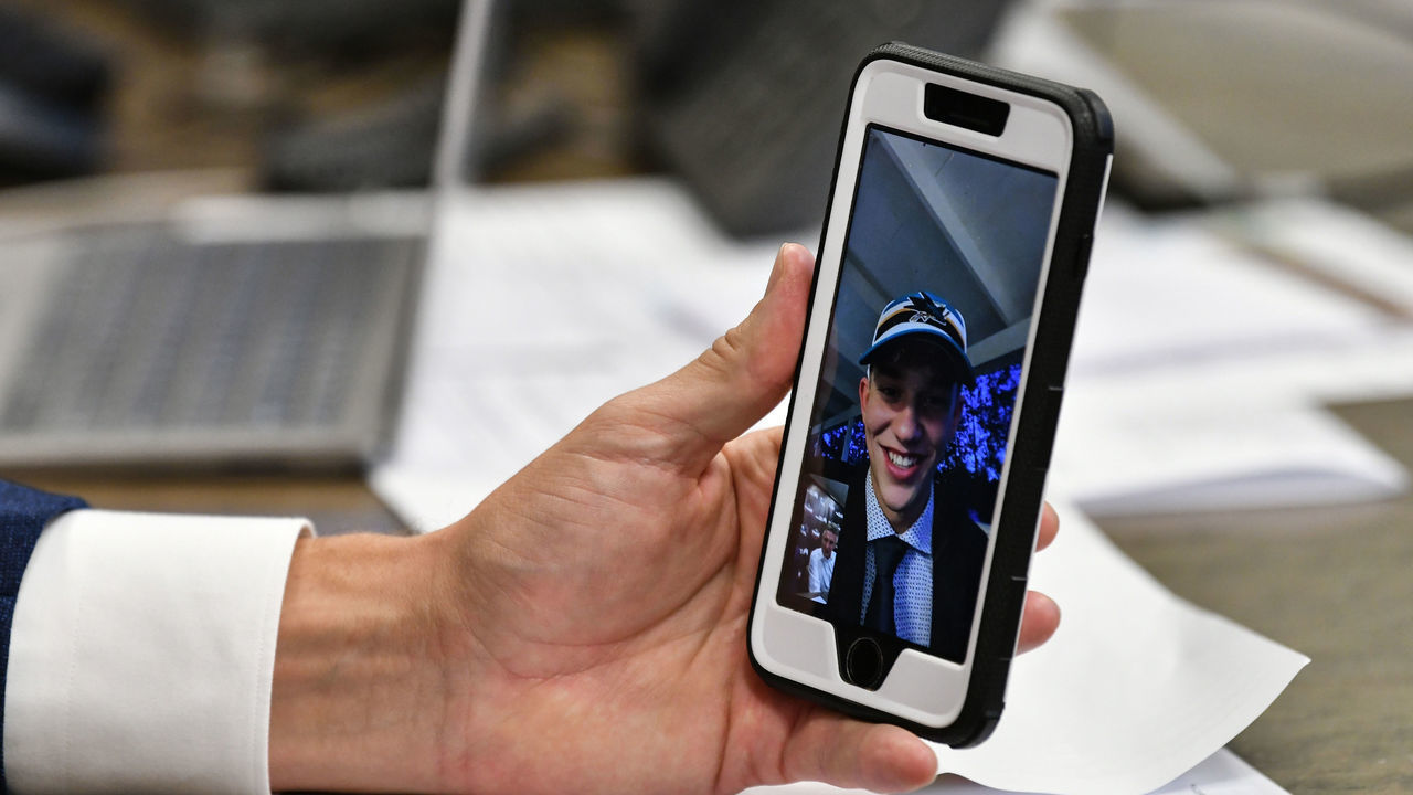 SAN JOSE, CA - JULY 23: San Jose Sharks Director of Scouting Doug Wilson Jr. facetimes William Eklund the seventh overall in the first round during the 2021 NHL Draft at SAP Center on July 23, 2021 in San Jose, California.