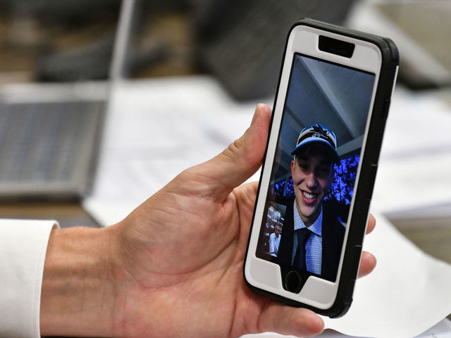 SAN JOSE, CA - JULY 23: San Jose Sharks Director of Scouting Doug Wilson Jr. facetimes William Eklund the seventh overall in the first round during the 2021 NHL Draft at SAP Center on July 23, 2021 in San Jose, California.