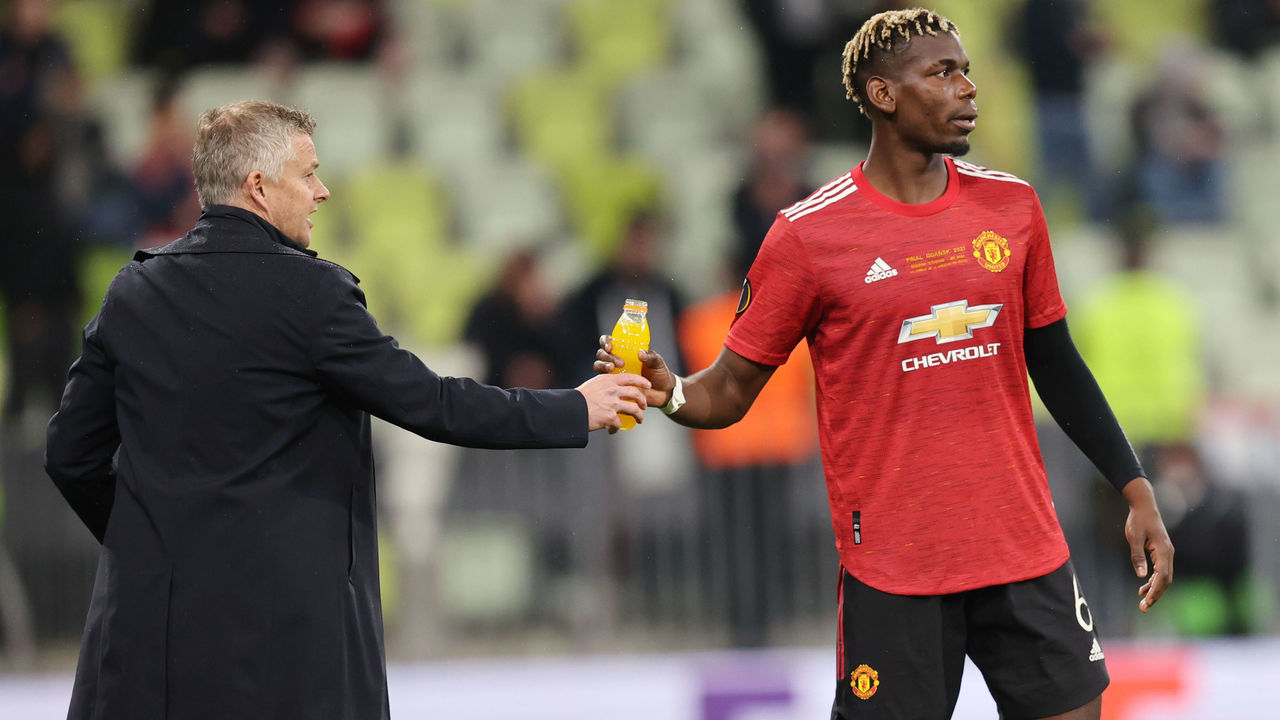 GDANSK, POLAND - MAY 26: Paul Pogba of Manchester United interacts with Ole Gunnar Solskjaer, Manager of Manchester United during the UEFA Europa League Final between Villarreal CF and Manchester United at Gdansk Arena on May 26, 2021 in Gdansk, Poland.