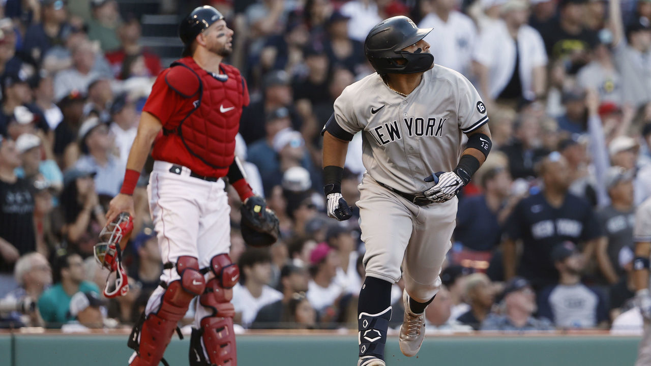 BOSTON, MA - JULY 24: Rougned Odor #12 of the New York Yankees and catcher Kevin Plawecki #25 of the Boston Red Sox watch Odors two run double during the eighth inning at Fenway Park on July 24, 2021 in Boston, Massachusetts.