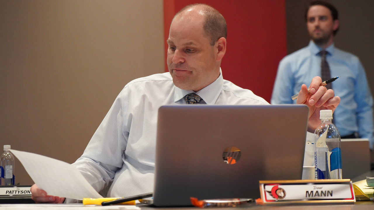 OTTAWA, CANADA - JULY 24: Chief Amateur Scout Trent Mann of the Ottawa Senators looks at his notes during rounds 2-7 of the 2021 NHL Entry Draft at Canadian Tire Centre on July 24, 2021 in Ottawa, Ontario, Canada.