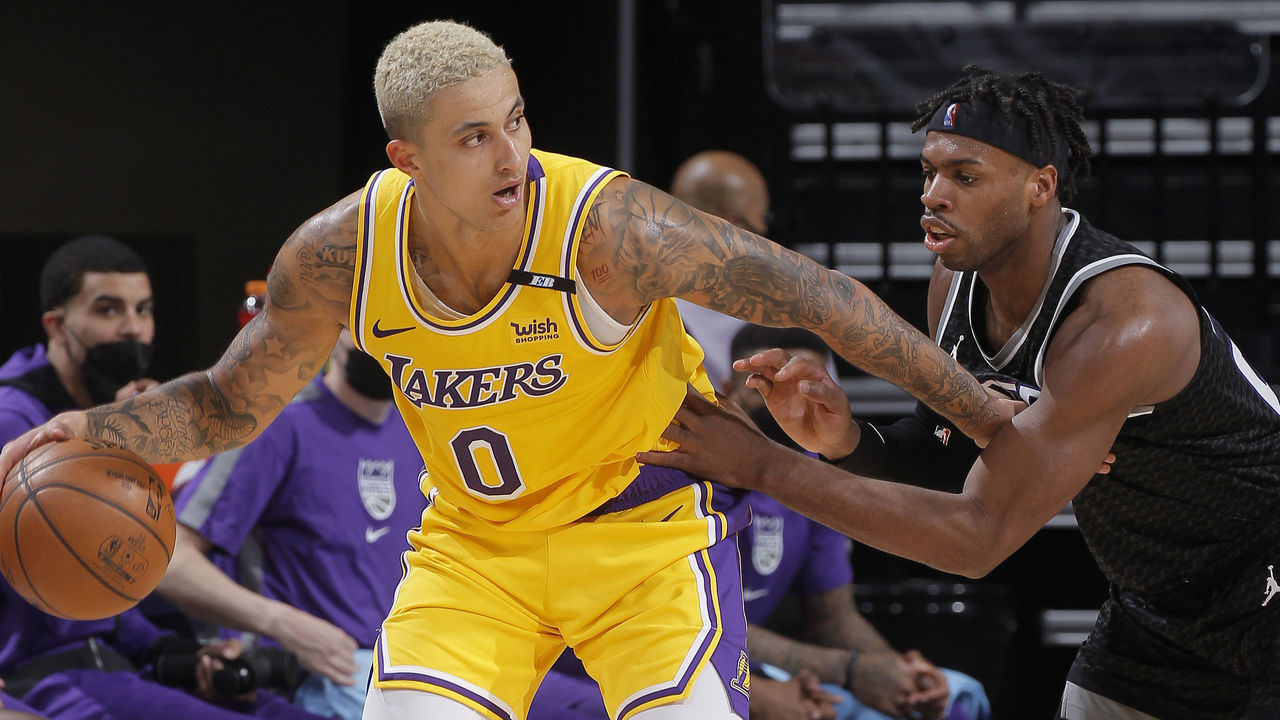 SACRAMENTO, CA - APRIL 2: Kyle Kuzma #0 of the Los Angeles Lakers handles the ball against Buddy Hield #24 of the Sacramento Kings on April 2, 2021 at Golden 1 Center in Sacramento, California. NOTE TO USER: User expressly acknowledges and agrees that, by downloading and or using this photograph, User is consenting to the terms and conditions of the Getty Images Agreement. Mandatory Copyright Notice: Copyright 2021 NBAE