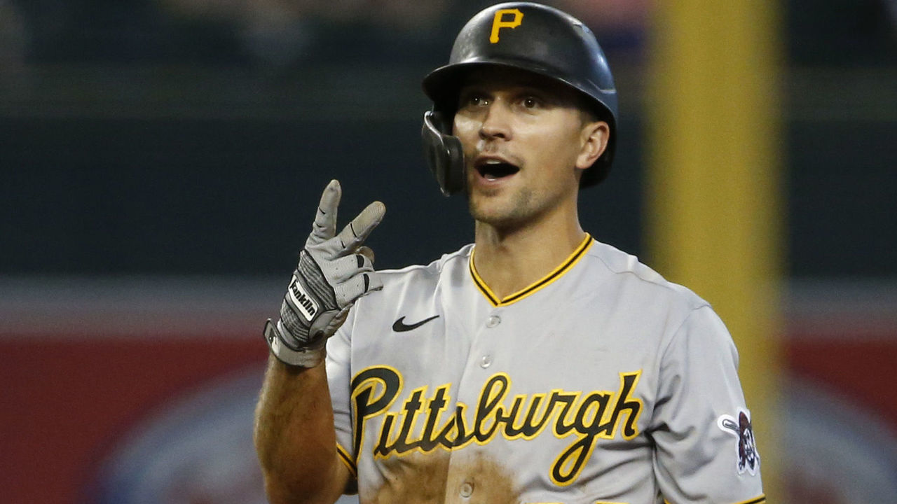 PHOENIX, ARIZONA - JULY 21: Adam Frazier #26 of the Pittsburgh Pirates gestures toward the Pirates dugout as he stands on second base while Josh Rojas #10 of the Arizona Diamondbacks looks on during the seventh inning of the MLB game at Chase Field on July 21, 2021 in Phoenix, Arizona.
