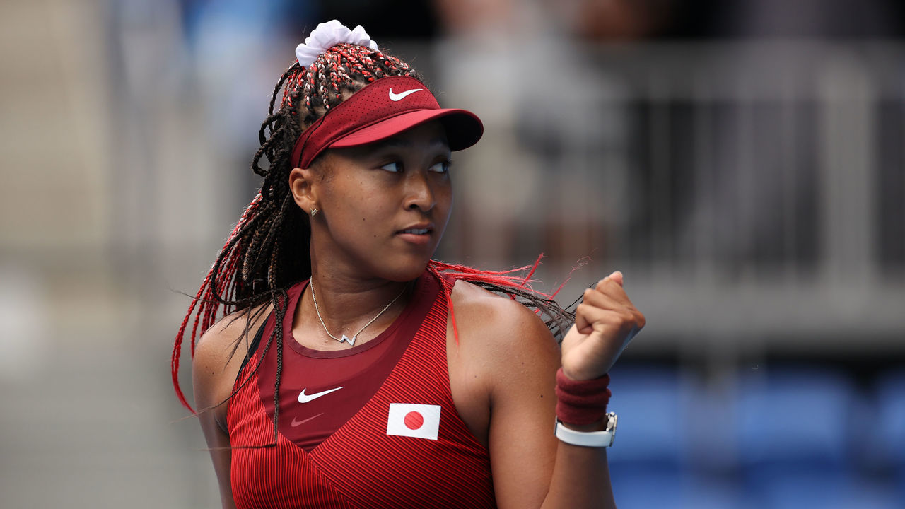 TOKYO, JAPAN - JULY 26: Naomi Osaka of Team Japan celebrates after match point in her Women's Singles Second Round match against Viktorija Golubic of Team Switzerland on day three of the Tokyo 2020 Olympic Games at Ariake Tennis Park on July 26, 2021 in Tokyo, Japan.