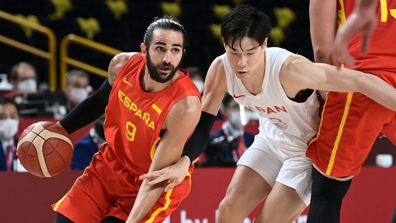 Spain's Ricky Rubio dribbles the ball past Japan's Yudai Baba in the men's preliminary round group C basketball match between Japan and Spain during the Tokyo 2020 Olympic Games at the Saitama Super Arena in Saitama on July 26, 2021.