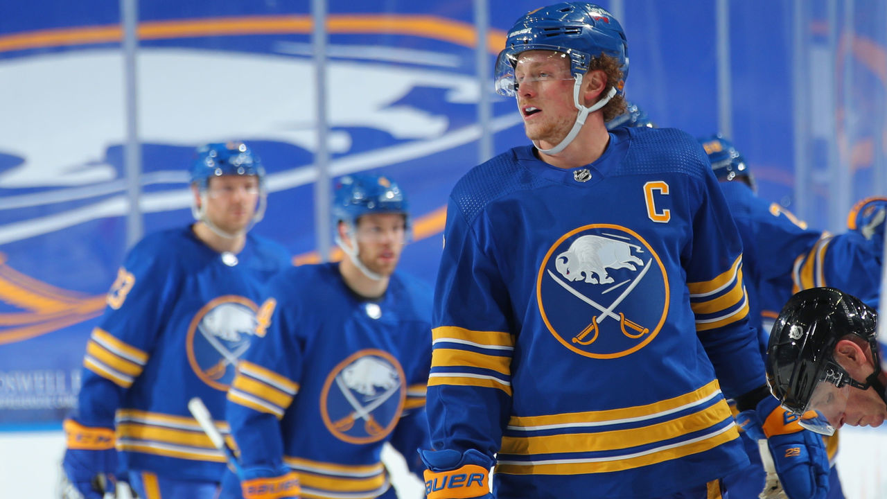 BUFFALO, NY - JANUARY 26: Jack Eichel #9 of the Buffalo Sabres celebrates his goal with teammates on the bench during an NHL game against the New York Rangers on January 26, 2021 at KeyBank Center in Buffalo, New York.
