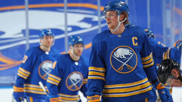BUFFALO, NY - JANUARY 26: Jack Eichel #9 of the Buffalo Sabres celebrates his goal with teammates on the bench during an NHL game against the New York Rangers on January 26, 2021 at KeyBank Center in Buffalo, New York.