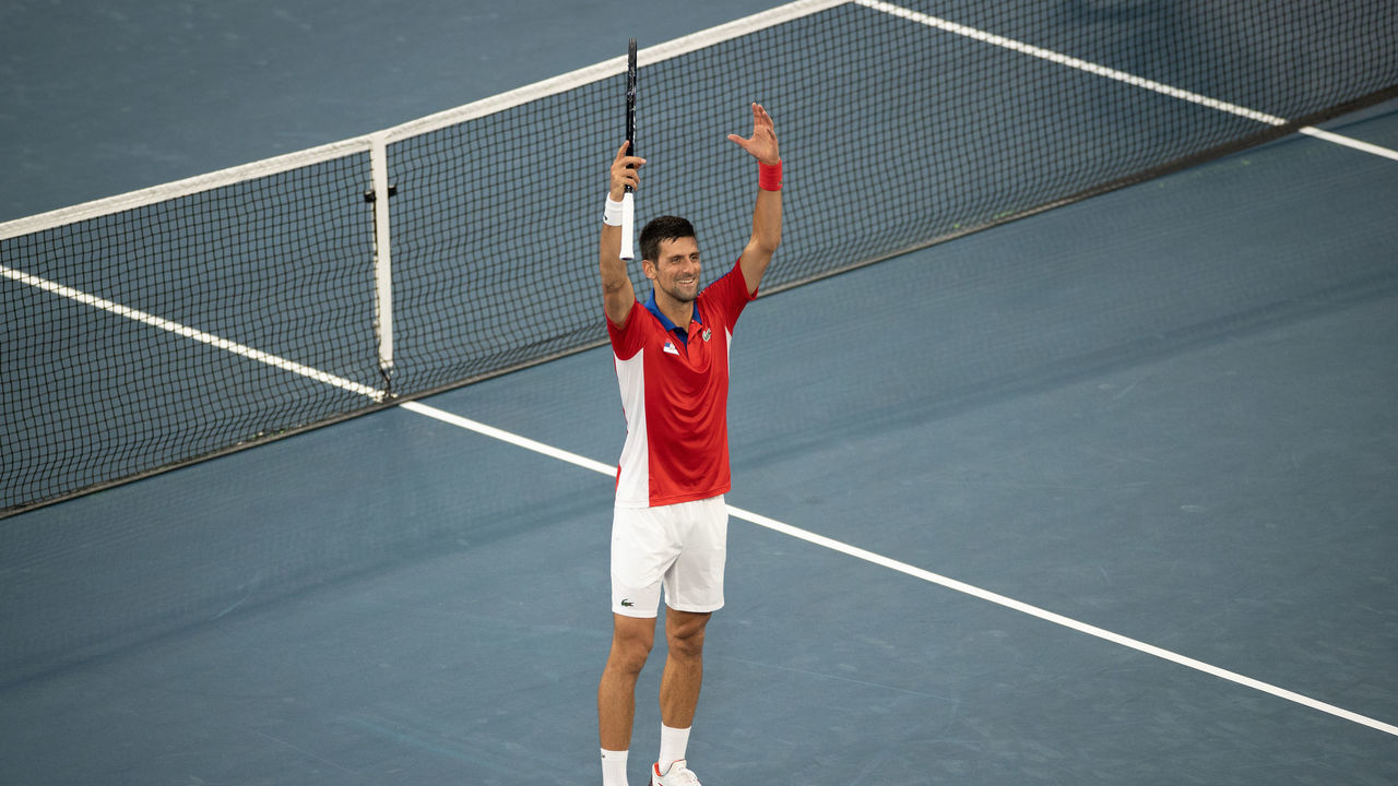 TOKYO, JAPAN - JULY 26: Novak Djokovic of Team Serbia celebrates after match point during his Men's Singles Second Round match against Jan-Lennard Struff of Team Germany on day three of the Tokyo 2020 Olympic Games at Ariake Tennis Park on July 26, 2021 in Tokyo, Japan.
