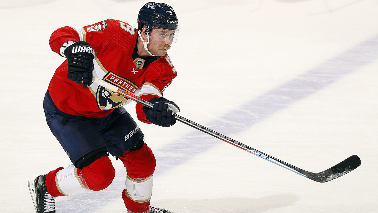 SUNRISE, FL - MAY 16: Sam Bennett #9 of the Florida Panthers passes the puck against the Tampa Bay Lightning in Game One of the First Round of the 2021 Stanley Cup Playoffs at the BB&T Center on May 16, 2021 in Sunrise, Florida.