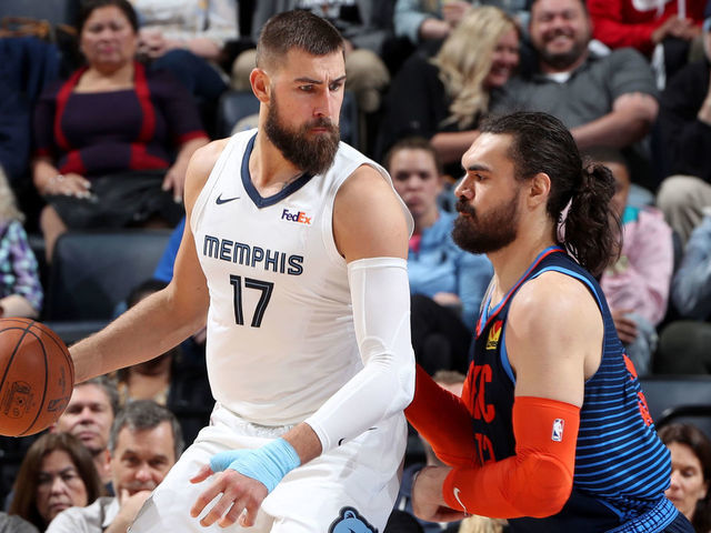 MEMPHIS, TN - MARCH 25: Jonas Valanciunas #17 of the Memphis Grizzlies handles the ball against Steven Adams #12 of the Oklahoma City Thunder on March 25, 2019 at FedExForum in Memphis, Tennessee. NOTE TO USER: User expressly acknowledges and agrees that, by downloading and/or using this photograph, user is consenting to the terms and conditions of the Getty Images License Agreement. Mandatory Copyright Notice: Copyright 2019 NBAE