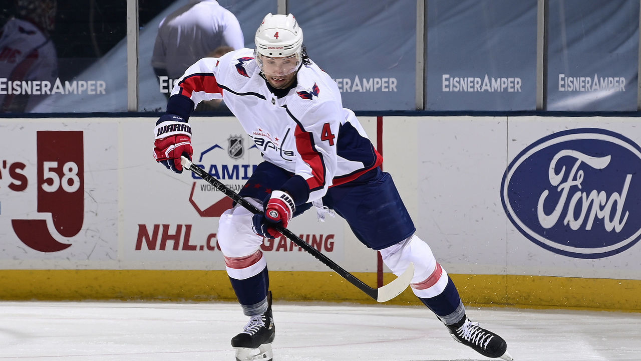 UNIONDALE, NEW YORK - APRIL 22: Brenden Dillon #4 of the Washington Capitals handles the puck against the New York Islanders during the second period at Nassau Coliseum on April 22, 2021 in Uniondale, New York.