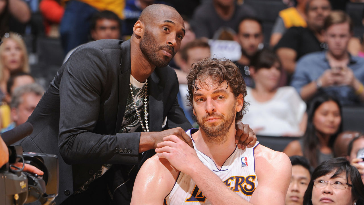 LOS ANGELES, CA - APRIL 28: Kobe Bryant #24 of the Los Angeles Lakers greets teammate Pau Gasol #16 on the bench as their team plays against the San Antonio Spurs in Game Four of the Western Conference Quarterfinals during the 2013 NBA Playoffs at Staples Center on April 28, 2013 in Los Angeles, California. NOTE TO USER: User expressly acknowledges and agrees that, by downloading and/or using this Photograph, user is consenting to the terms and conditions of the Getty Images License Agreement. Mandatory Copyright Notice: Copyright 2013 NBAE