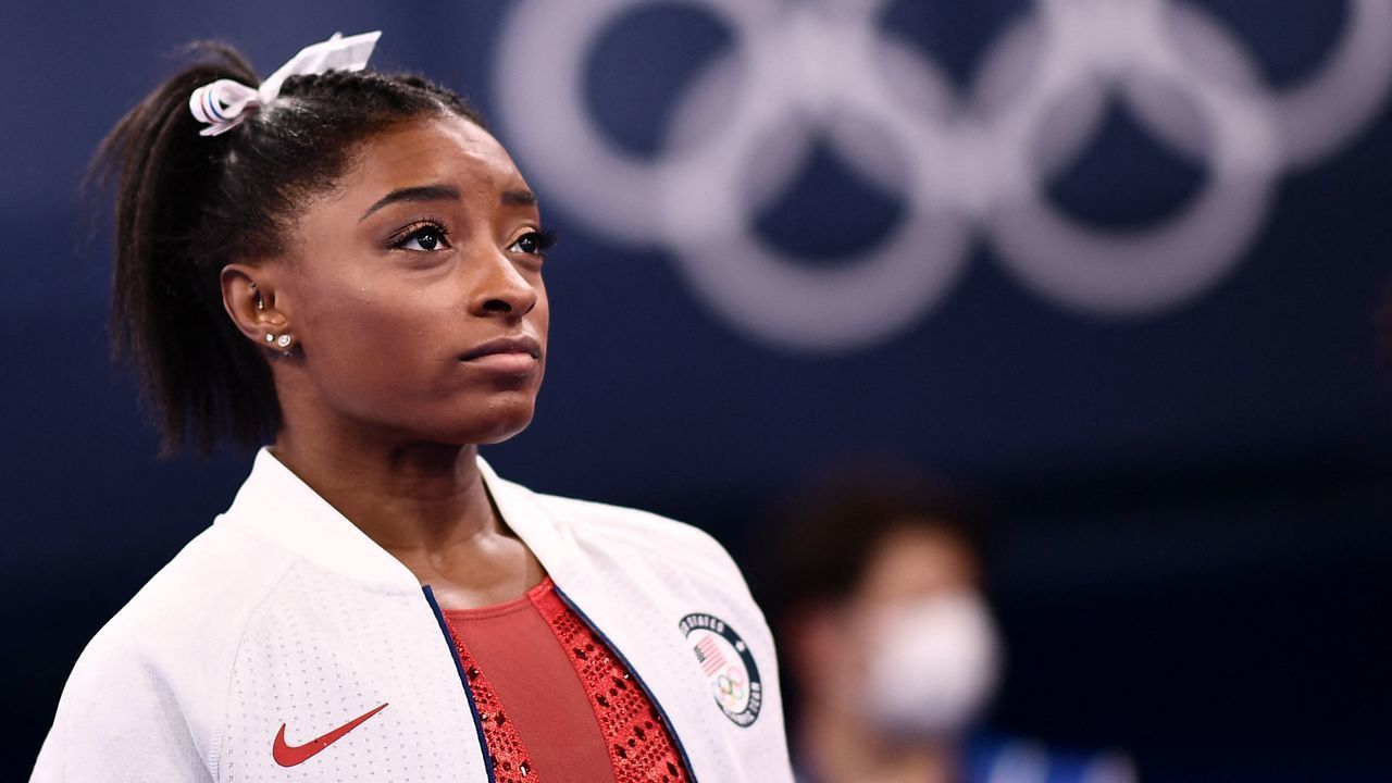 USA's Simone Biles looks on during the artistic gymnastics women's team final during the Tokyo 2020 Olympic Games at the Ariake Gymnastics Centre in Tokyo on July 27, 2021.