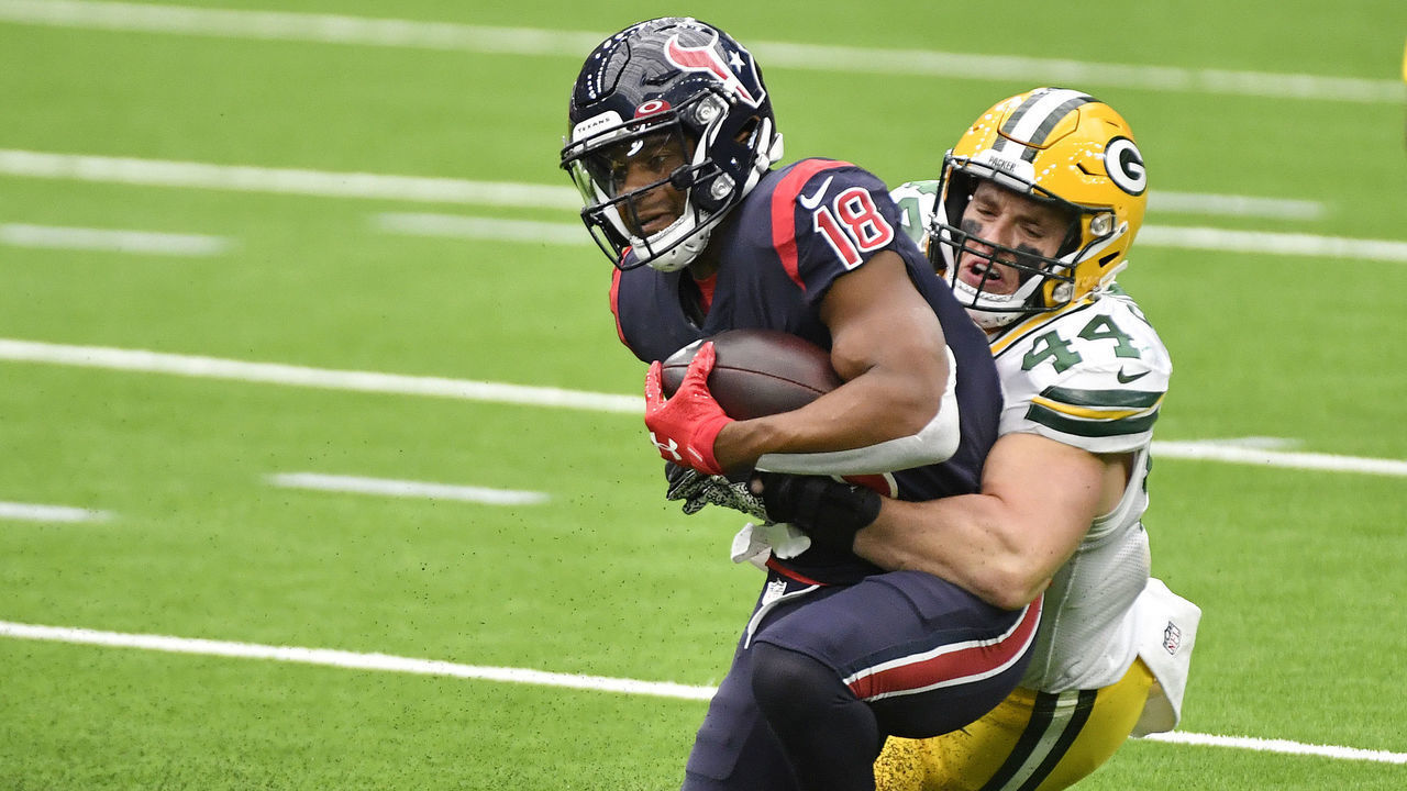 HOUSTON, TEXAS - OCTOBER 25: Randall Cobb #18 of the Houston Texans is tackled by Ty Summers #44 of the Green Bay Packers after a reception during the third quarter at NRG Stadium on October 25, 2020 in Houston, Texas.