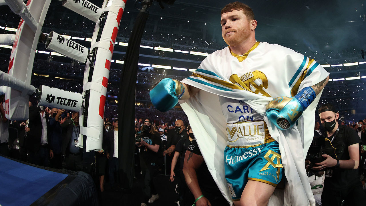 ARLINGTON, TEXAS - MAY 08: Canelo Alvarez enters the ring against Billy Joe Saunders before their fight for Alvarez's WBC and WBA super middleweight titles and Saunders' WBO super middleweight title at AT&T Stadium on May 08, 2021 in Arlington, Texas.