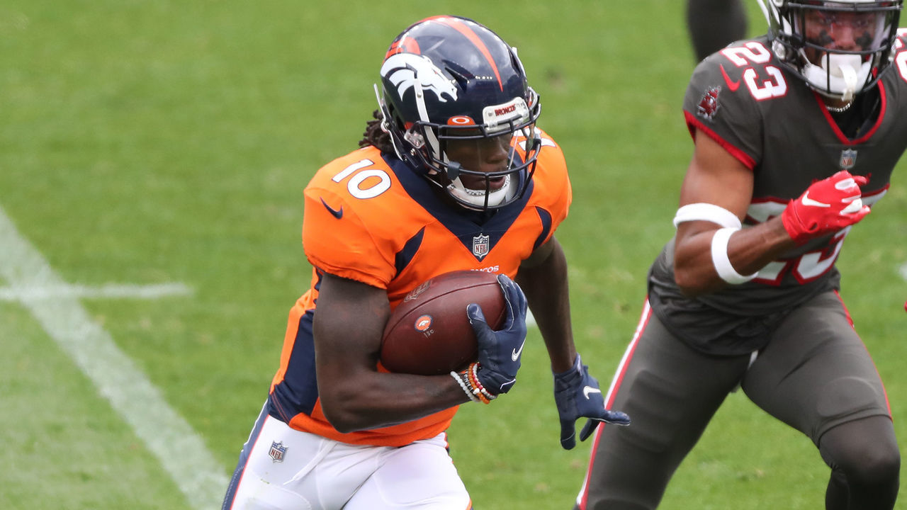 DENVER, COLORADO - SEPTEMBER 27: Wide receiver Jerry Jeudy #10 of the Denver Broncos rushes past cornerback Sean Murphy-Bunting #23 of the Tampa Bay Buccaneers during the first half at Empower Field At Mile High on September 27, 2020 in Denver, Colorado.