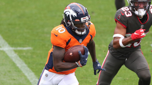 DENVER, COLORADO - SEPTEMBER 27: Wide receiver Jerry Jeudy #10 of the Denver Broncos rushes past cornerback Sean Murphy-Bunting #23 of the Tampa Bay Buccaneers during the first half at Empower Field At Mile High on September 27, 2020 in Denver, Colorado.