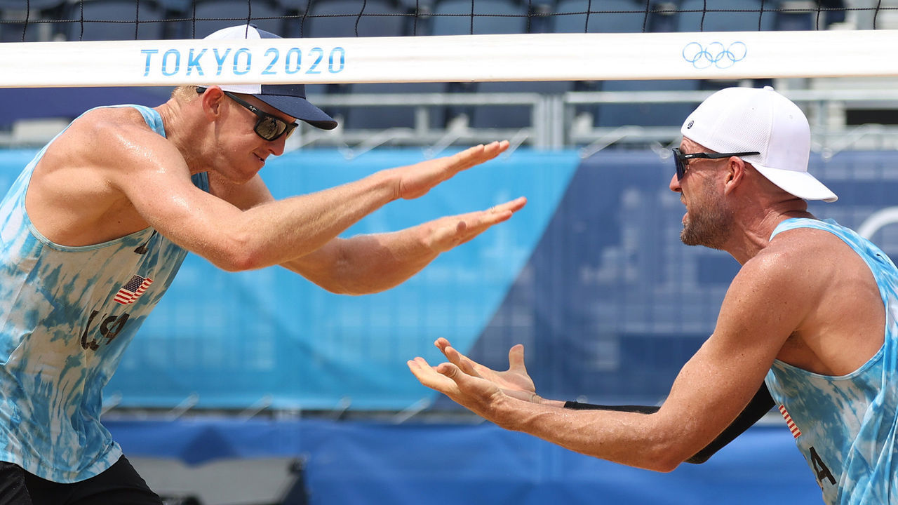 TOKYO, JAPAN - JULY 28: Jacob Gibb #1 of Team United States and Tri Bourne #2 of Team United States celebrate after defeating Team Switzerland during the Men's Preliminary Round - Pool C beach volleyball on day five of the Tokyo 2020 Olympic Games at Shiokaze Park on July 28, 2021 in Tokyo, Japan.