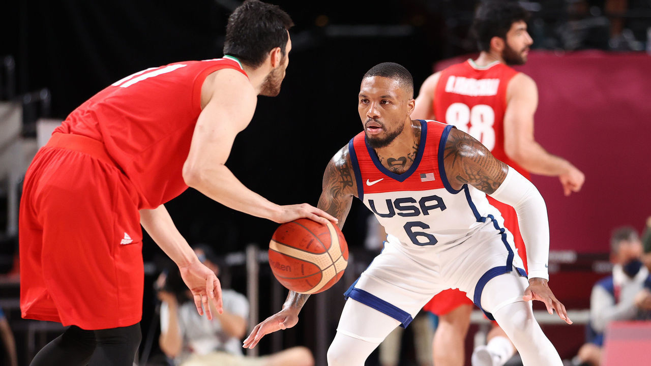 SAITAMA, JAPAN - JULY 28: Damian Lillard #6 of Team United States defends against Navid Rezaeifar #17 of Team Iran during the first half of a Men's Preliminary Round Group A game on day five of the Tokyo 2020 Olympic Games at Saitama Super Arena on July 28, 2021 in Saitama, Japan.