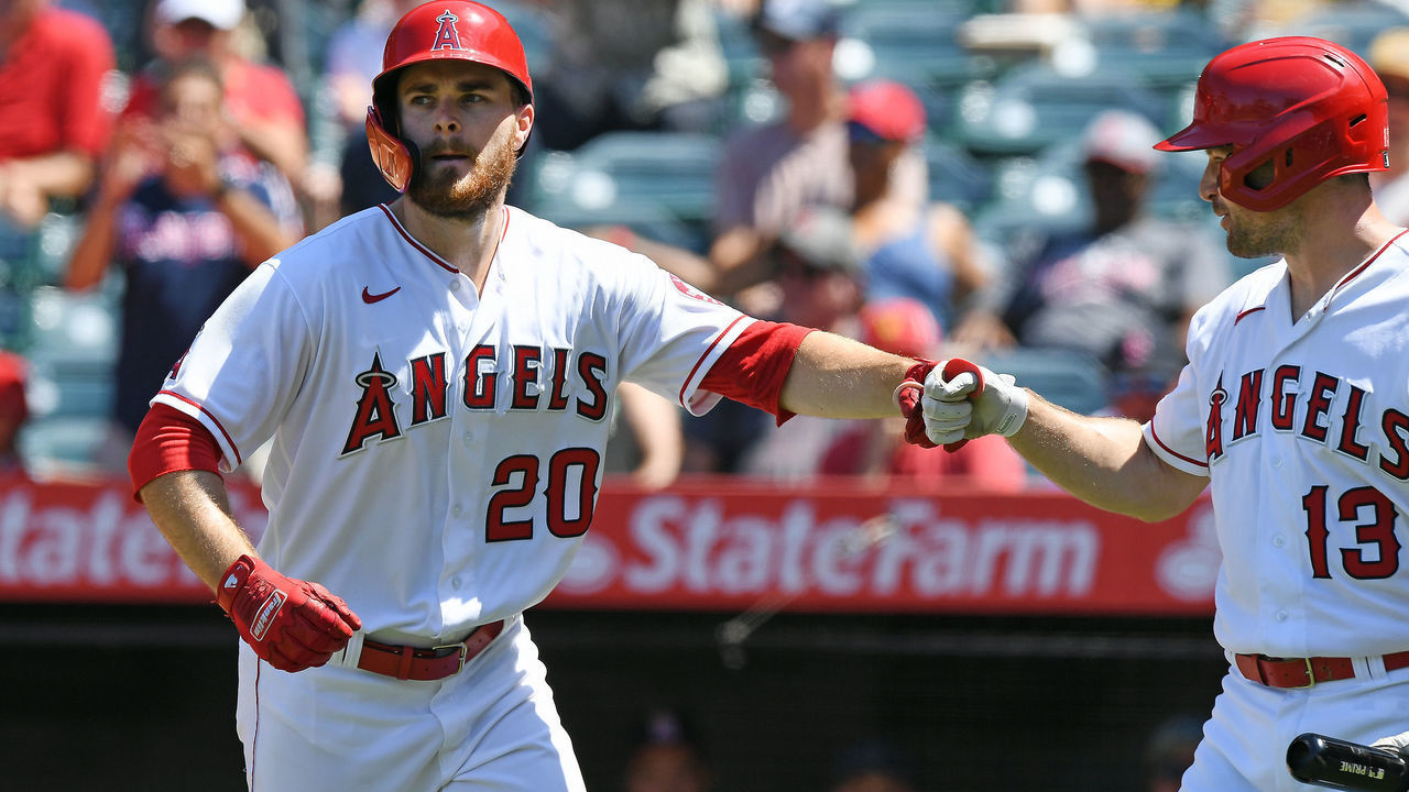 ANAHEIM, CA - JULY 07: Los Angeles Angels first baseman Jared Walsh (20) is greeted by left fielder Phil Gosselin (13) after Walsh hit a solo home run in the fifth inning of a game against the Boston Red Sox played on July 7, 2021 at Angels Stadium in Anaheim, CA.