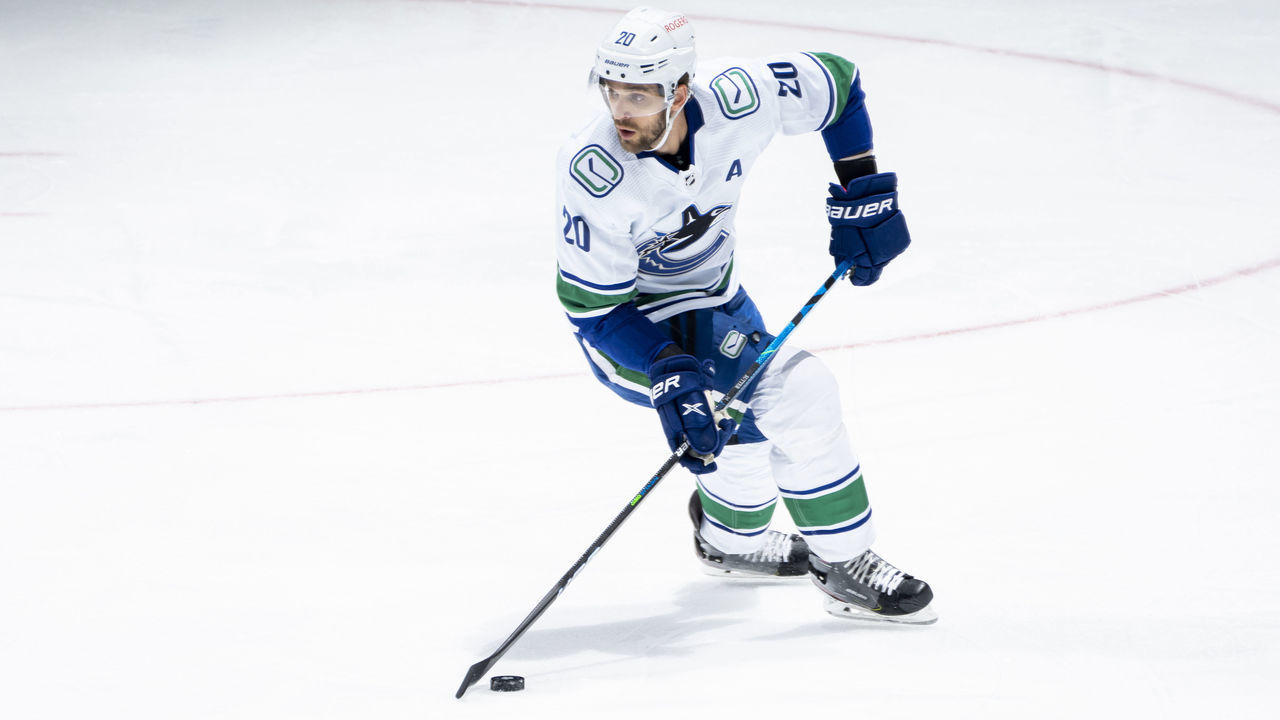 TORONTO, ON - APRIL 29: Brandon Sutter #20 of the Vancouver Canucks plays the puck against the Toronto Maple Leafs during the first period at the Scotiabank Arena on April 29, 2021 in Toronto, Ontario, Canada.