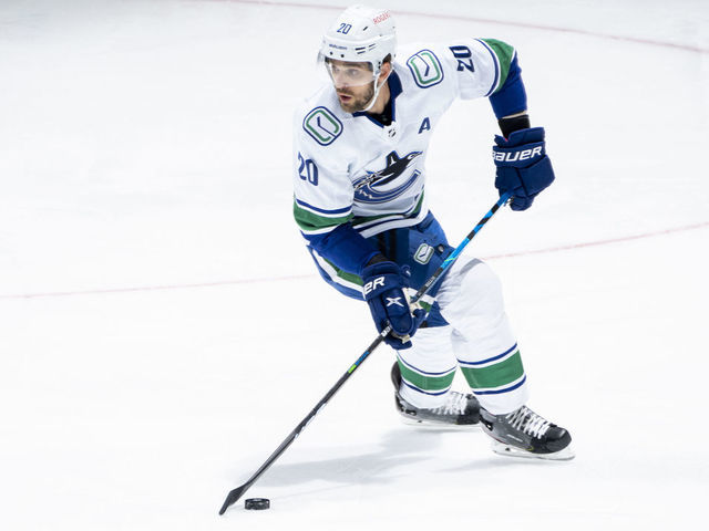TORONTO, ON - APRIL 29: Brandon Sutter #20 of the Vancouver Canucks plays the puck against the Toronto Maple Leafs during the first period at the Scotiabank Arena on April 29, 2021 in Toronto, Ontario, Canada.