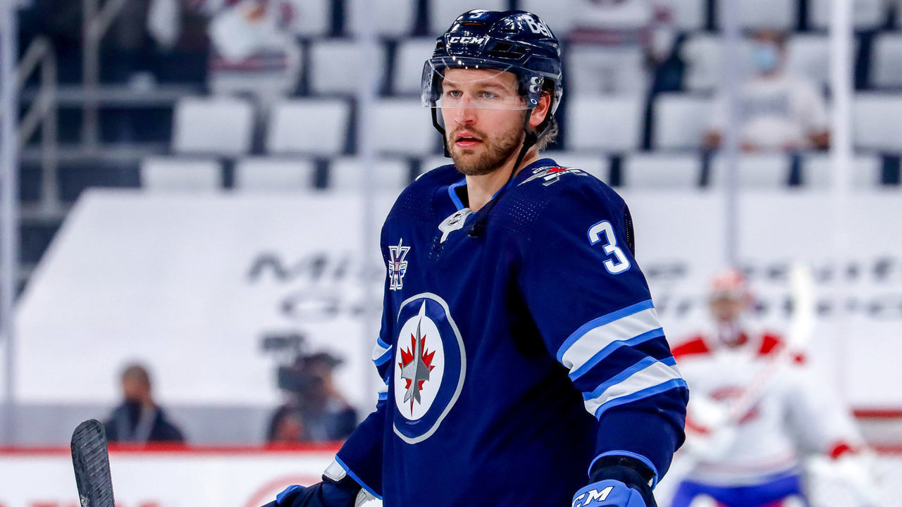 WINNIPEG, MB - JUNE 2: Tucker Poolman #3 of the Winnipeg Jets looks on during the pre-game warm up prior to NHL action against the Montreal Canadiens in Game One of the Second Round of the 2021 Stanley Cup Playoffs at the Bell MTS Place on June 2, 2021 in Winnipeg, Manitoba, Canada.