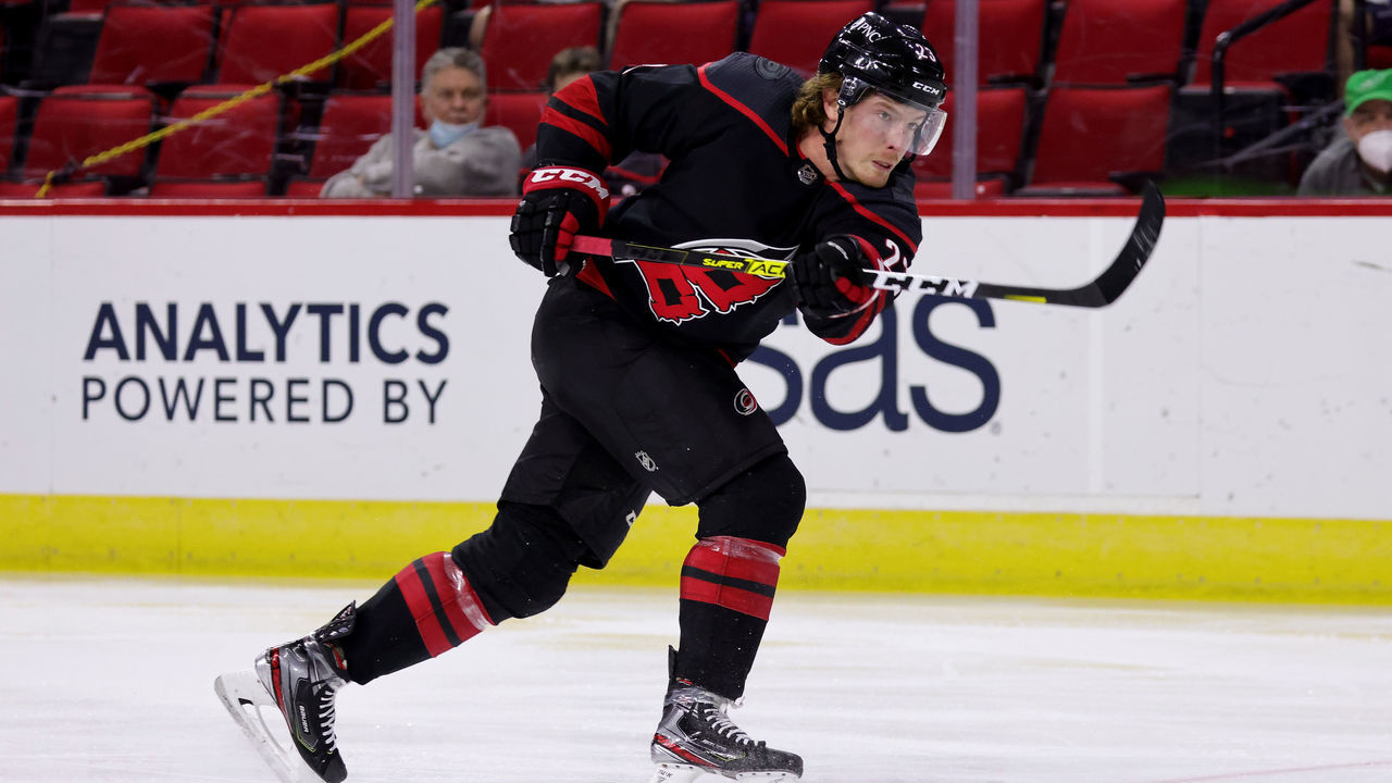 RALEIGH, NC - MARCH 27: Brock McGinn #23 of the Carolina Hurricanes shoots the puck during an NHL game against the Tampa Bay Lightning on March 27, 2021 at PNC Arena in Raleigh, North Carolina.