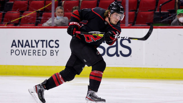 RALEIGH, NC - MARCH 27: Brock McGinn #23 of the Carolina Hurricanes shoots the puck during an NHL game against the Tampa Bay Lightning on March 27, 2021 at PNC Arena in Raleigh, North Carolina.