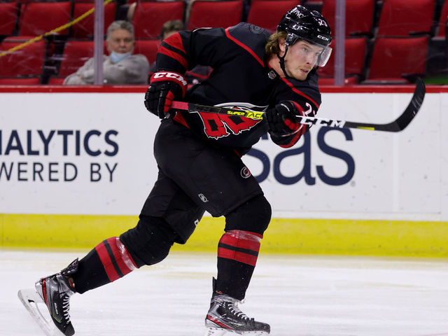 RALEIGH, NC - MARCH 27: Brock McGinn #23 of the Carolina Hurricanes shoots the puck during an NHL game against the Tampa Bay Lightning on March 27, 2021 at PNC Arena in Raleigh, North Carolina.